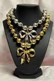 Bold Metallic Bow Statement Necklace – Gold & Silver